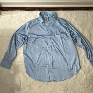 H&M light blue silk like v-neck button down shirt. Woman’s size XL
